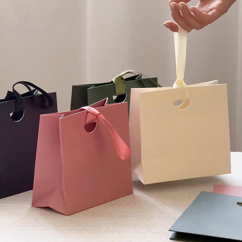 取っ手付きの紙製ハンドバッグ型ギフトバッグ20個入り。パーテ - Kraft Box Candle のレビューと価格